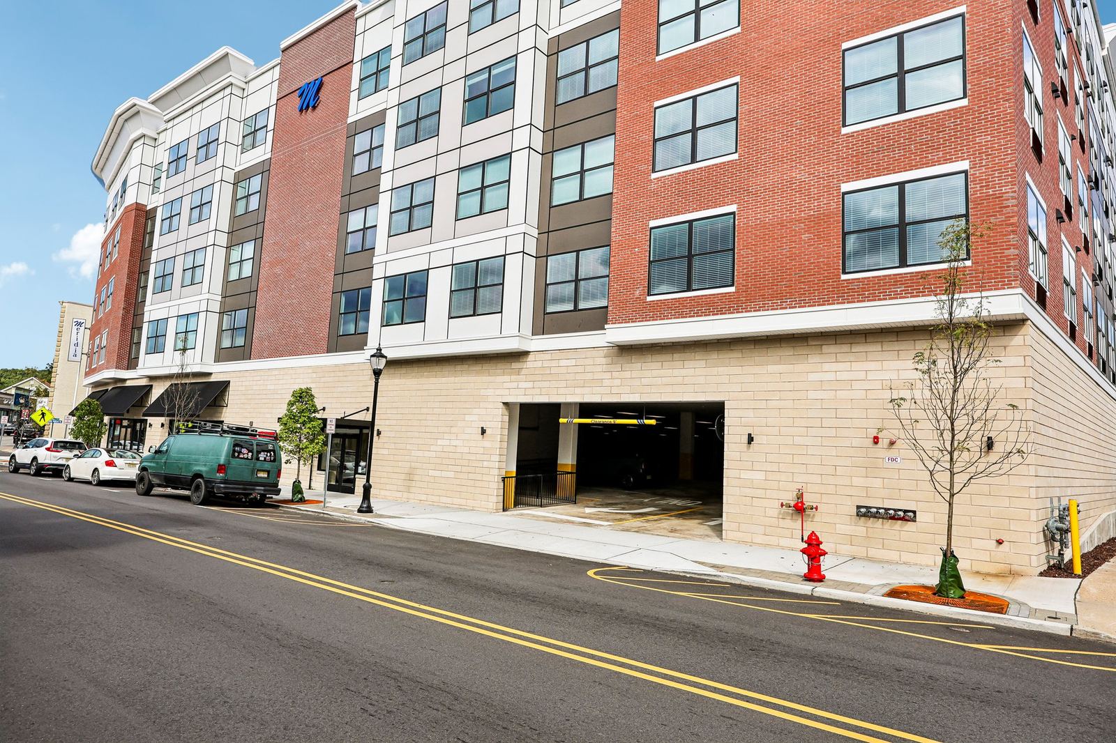 Meridia Pompton Lakes street-level view of the covered parking garage entrance at 261 Wanaque Ave