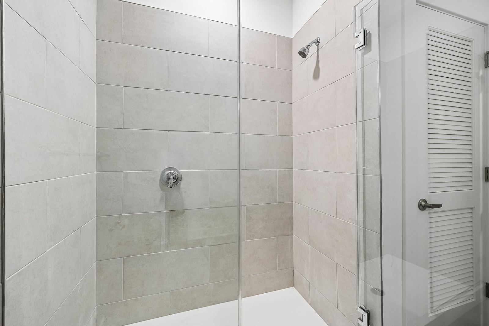 Meridia Pompton Lakes apartment bathroom with glass shower enclosure