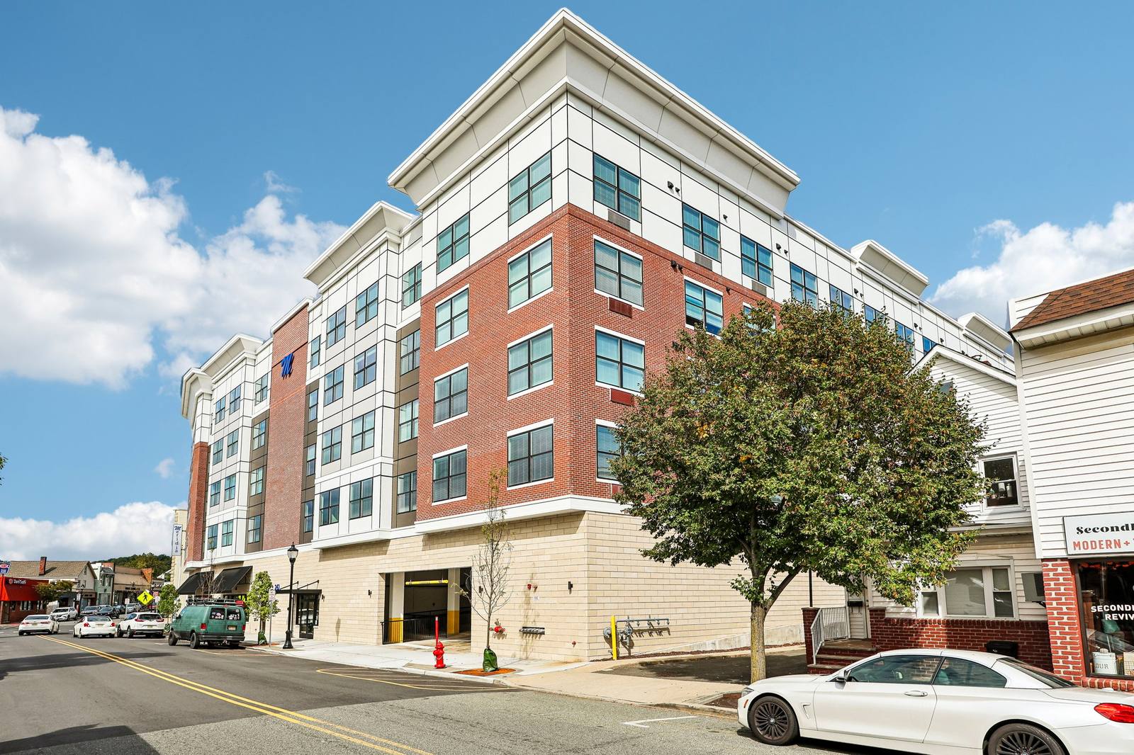 Meridia Pompton Lakes apartment building exterior — real photo of the brick and stone facade at 261 Wanaque Ave, Pompton Lakes NJ