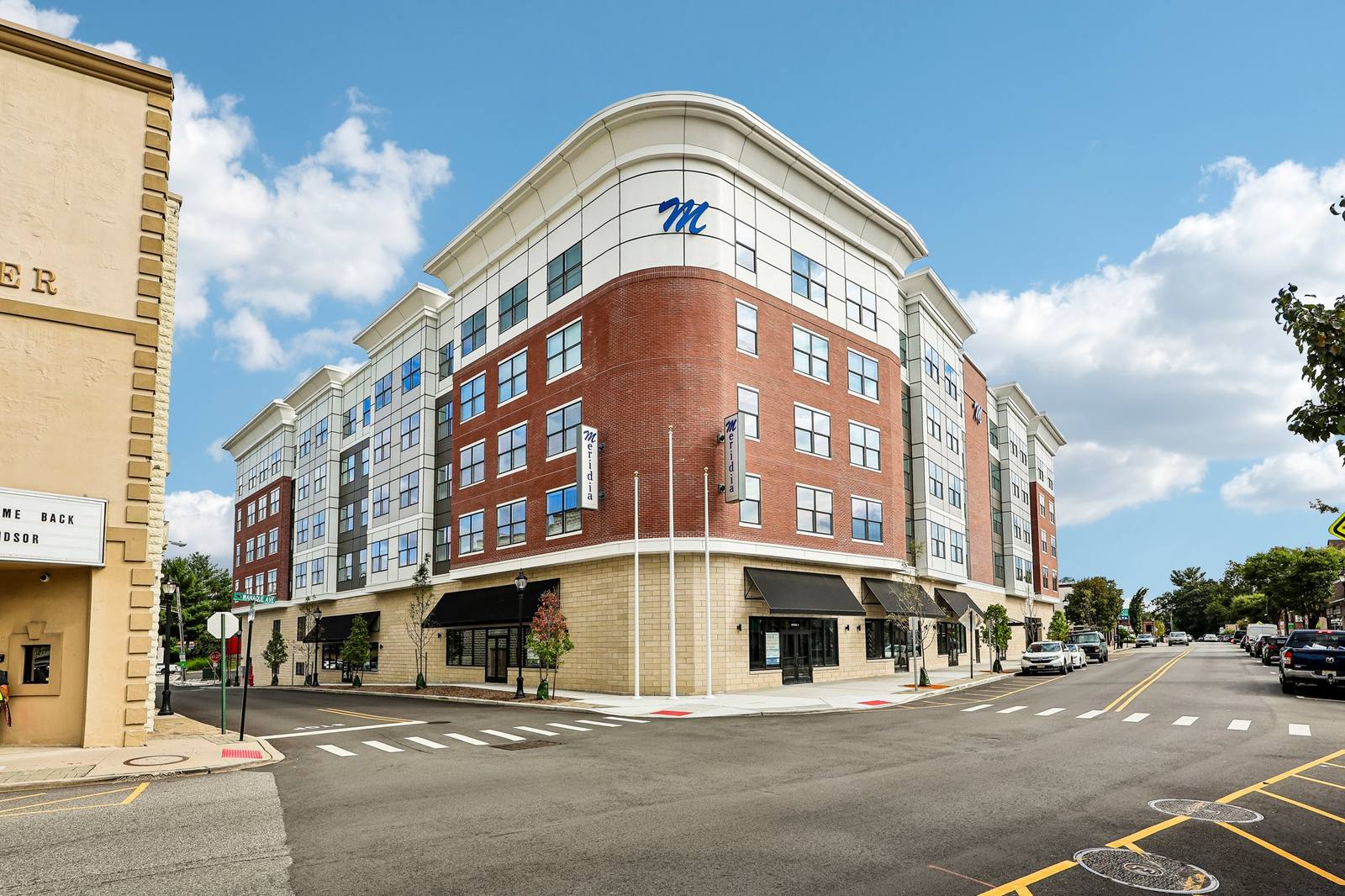 Meridia Pompton Lakes — real photo of the brick and stone facade with Meridia signage, corner of Wanaque Ave, Pompton Lakes NJ